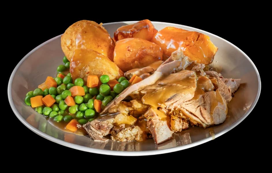 Roast lamb meal with roast potatoes, pumpkin, peas and carrots